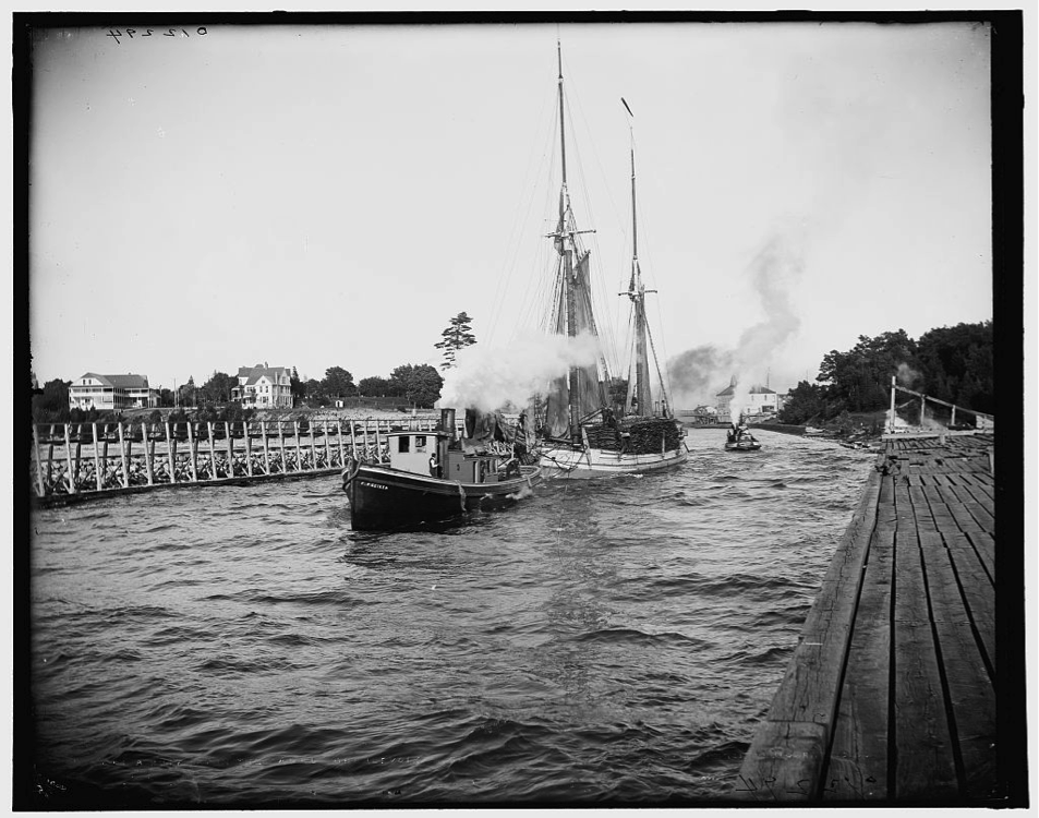 Timber schooner leaving the channel at Charlevoix, Michigan, 1900. “The Bigler” was a timber drogher, a ship specially built to carry squared logs.